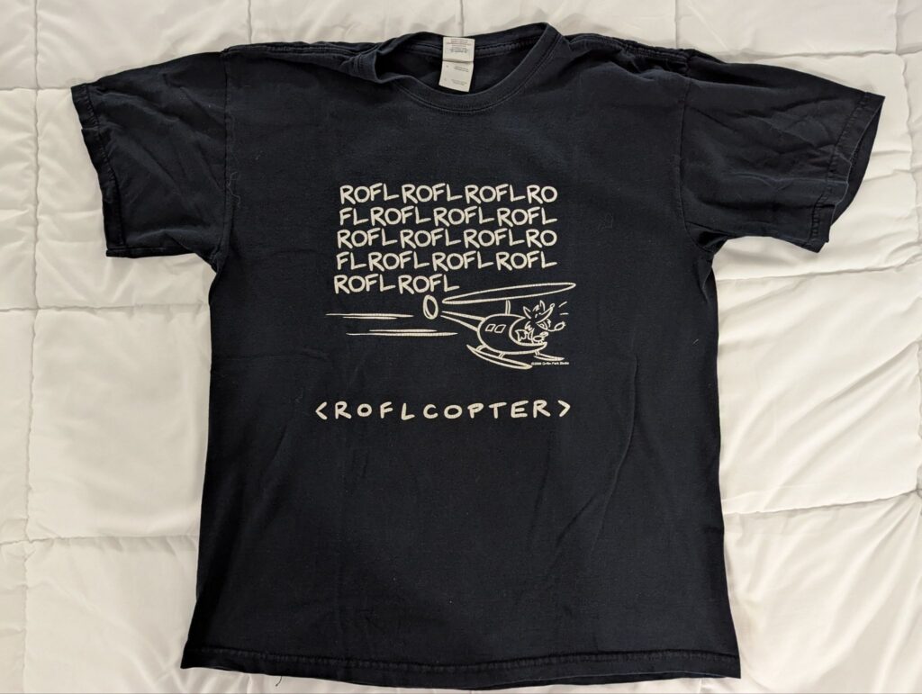 A roflcopter: a helicopter with an anthro character steering, the blades producing the sound ROFL ("rolling on the floor laughing") over and over.